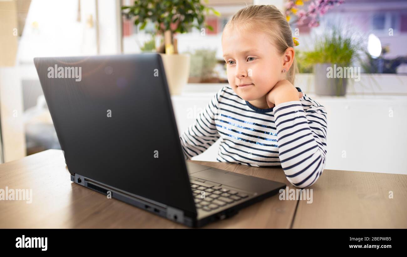 student is interested in watching computer during home study, sun from ...