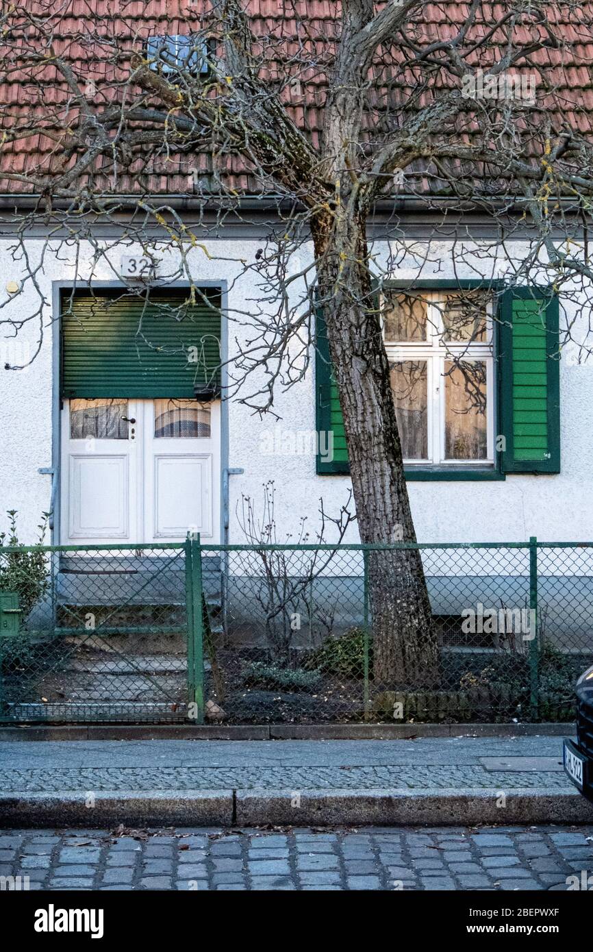 Residential house with pitched roof and green shutters built about1820, Listed building at Alt-Rudow 32, Rudow Berlin,Germany Stock Photo