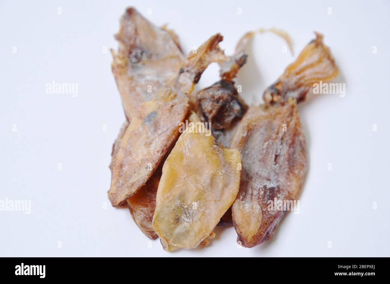 dry squid ingredient food on white background Stock Photo - Alamy
