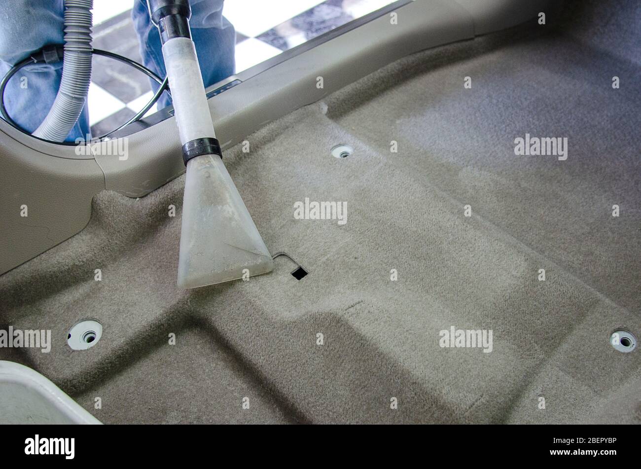 Clean the car carpet with a cleaning machine.Kill germs with chemicals