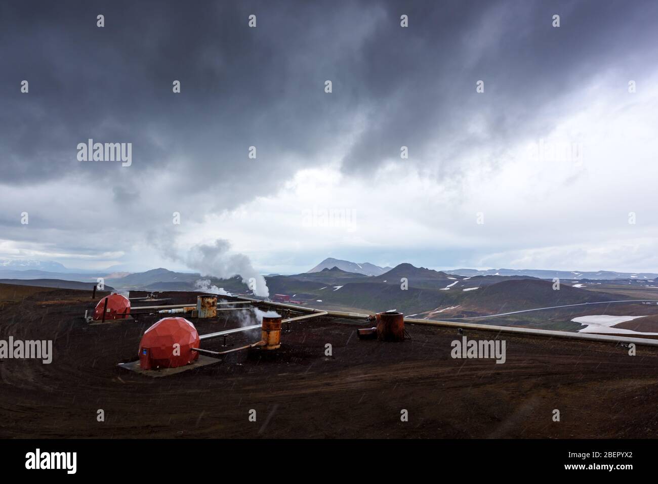 Geothermal energy power plant in Iceland mountains. Industrial landscape Stock Photo