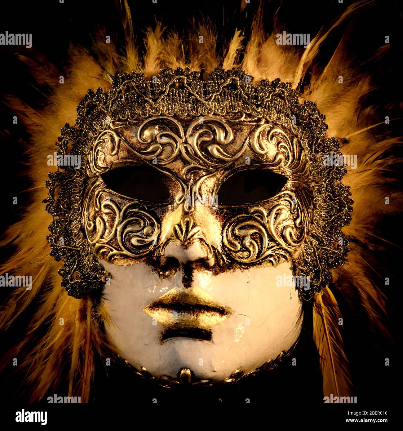 Venetian mask in glod with fur surround Stock Photo