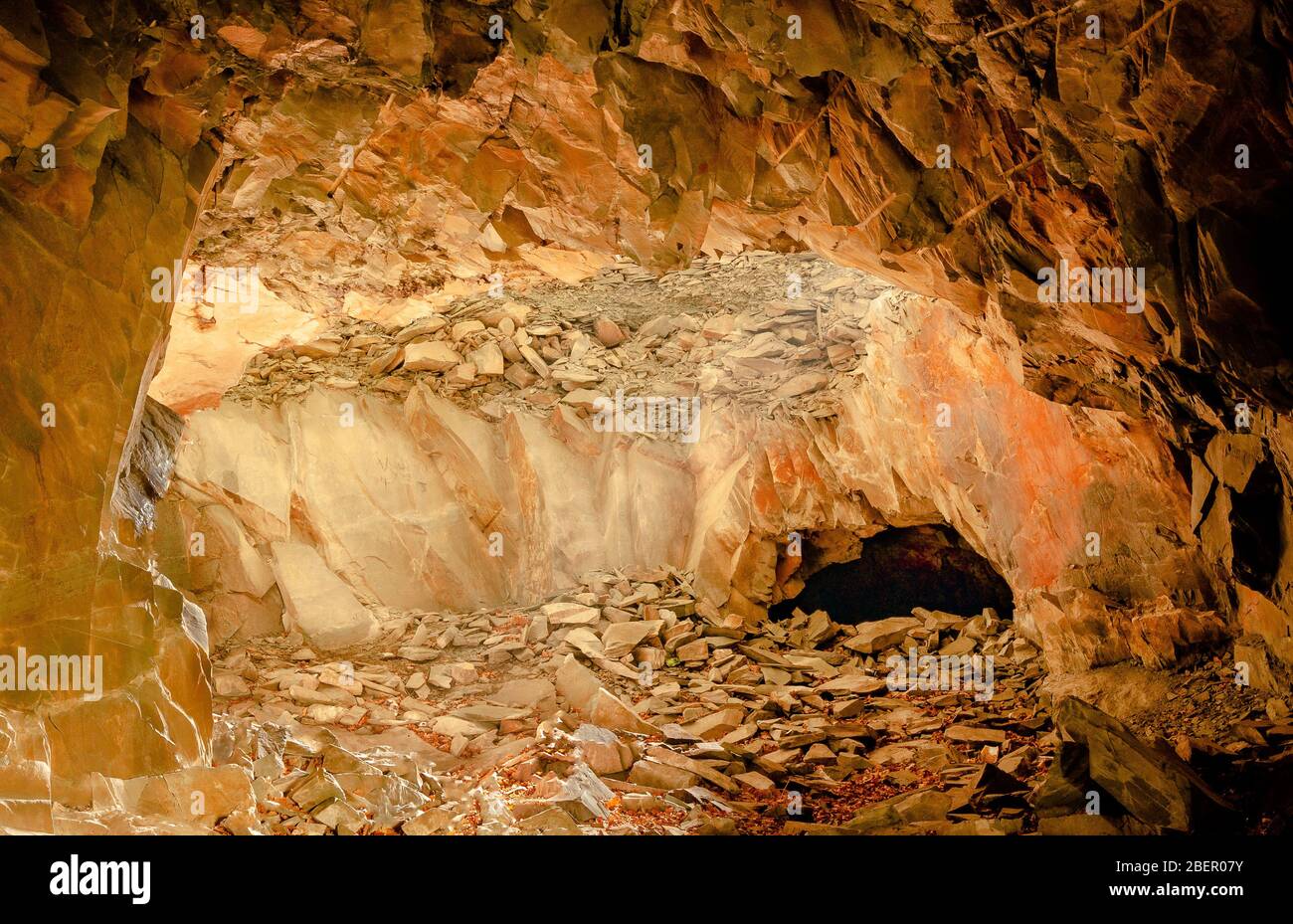 Beautiful colours inside a cave at an abandoned slate quarry Stock