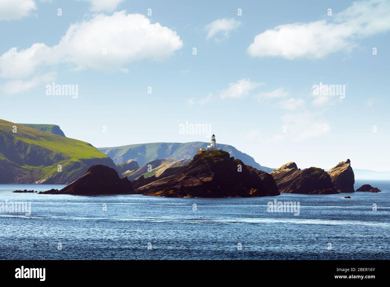 Seascape with lighthouse on the isle Muckle Flugga, United Kingdom, Scotland, Shetland Islands. Landscape photography Stock Photo