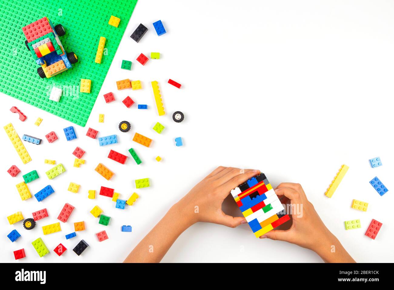 Vilnius, Lithuania - 17 August, 2019: Child hands playing with colorful Lego  bricks blocks on white table Stock Photo - Alamy