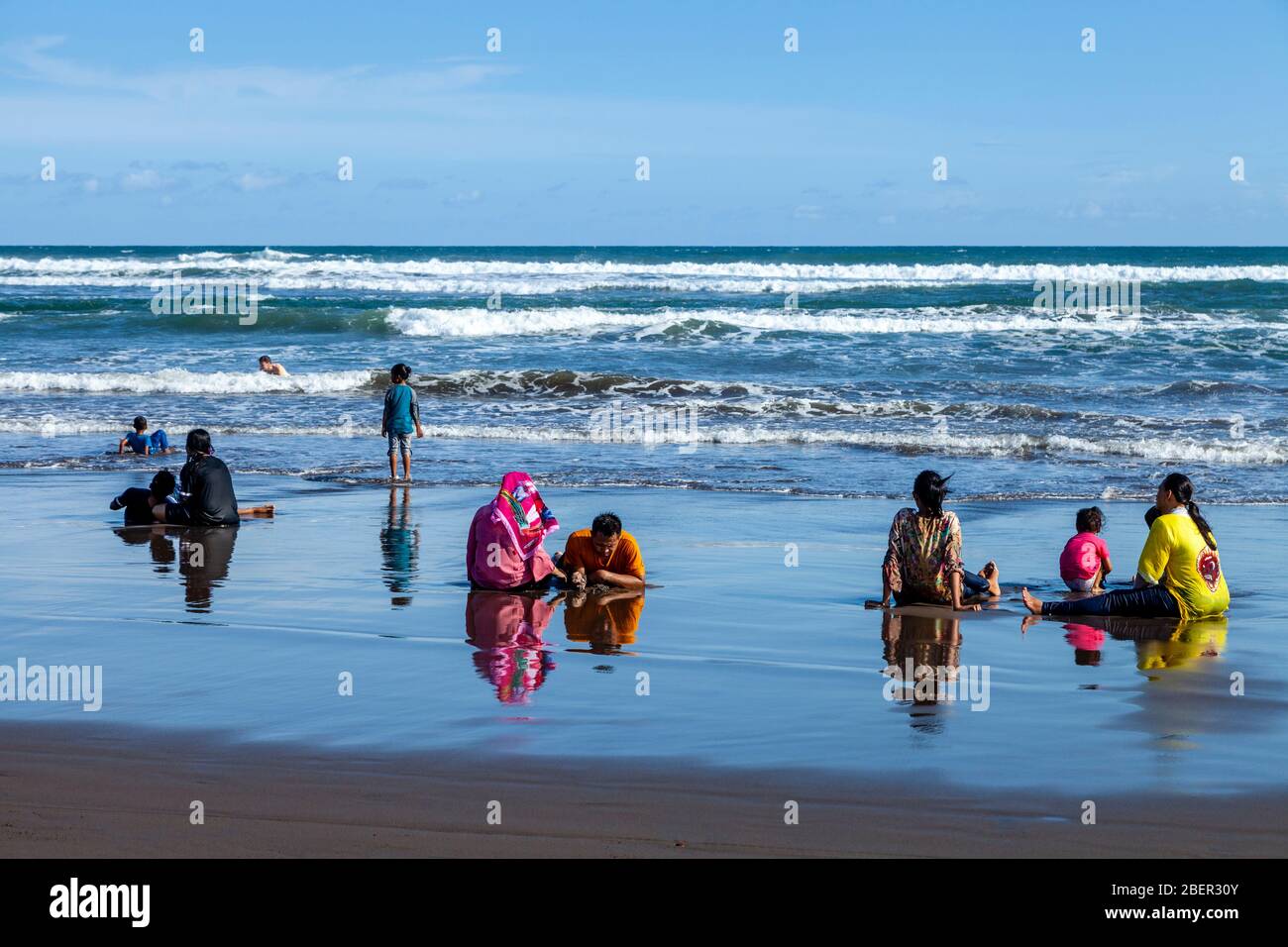 Indonesian People On Parangtritis Beach, Yogyakarta, Indonesia. Stock Photo