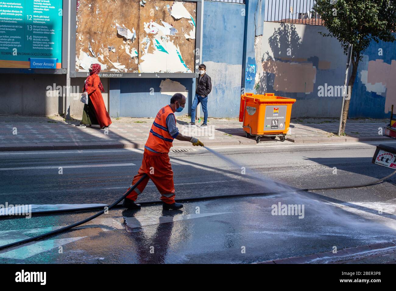 The teams affiliated to the Zeytinburnu Municipality carry out their disinfection activities due to the coronavirus on the streets in Zeytinburnu. Stock Photo