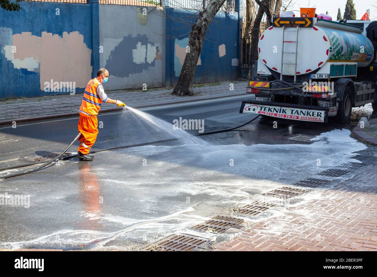 The teams affiliated to the Zeytinburnu Municipality carry out their disinfection activities due to the coronavirus on the streets in Zeytinburnu. Stock Photo