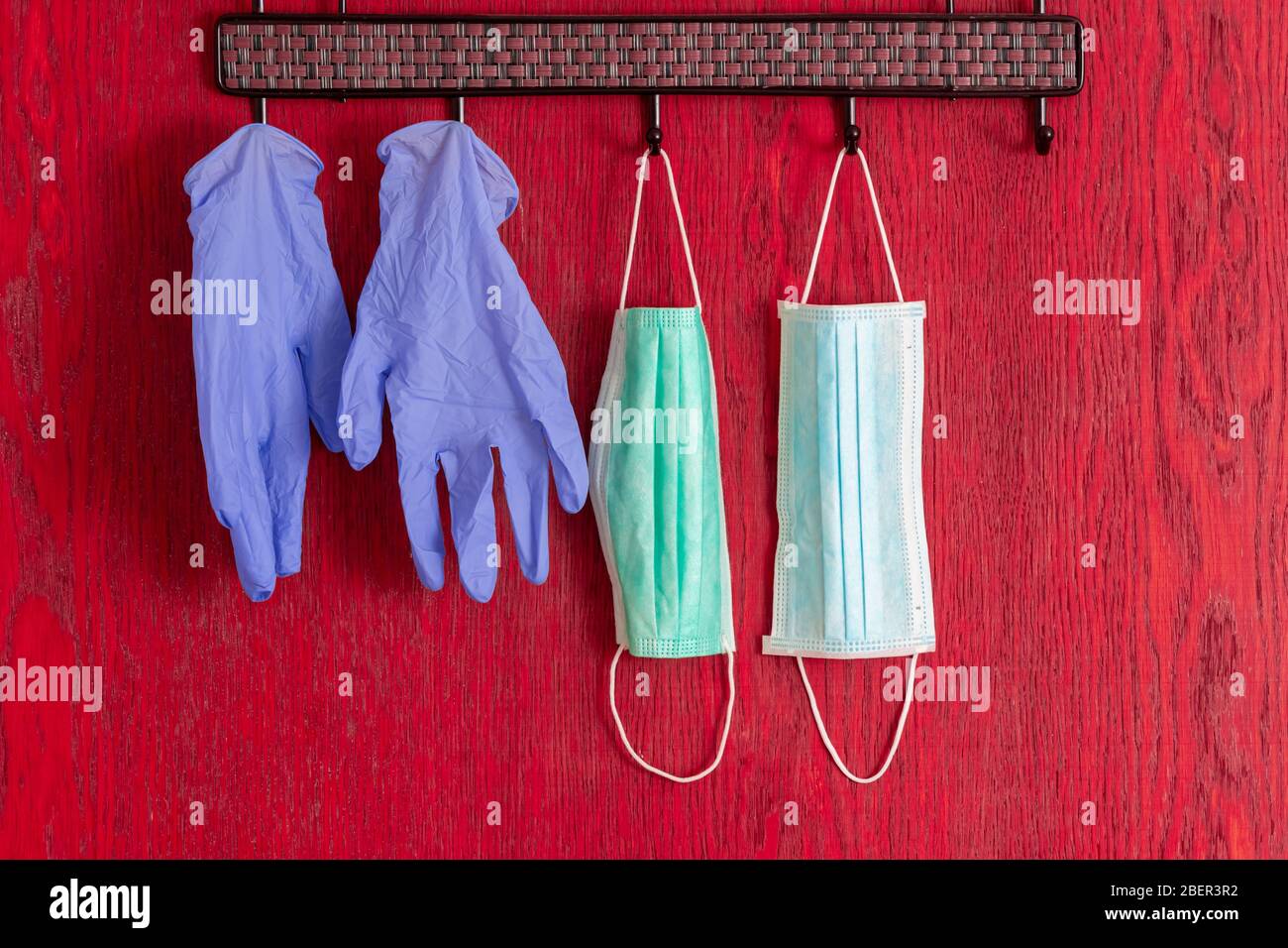 medical mask and gloves hanging in row close up background for protection from virus covid-19 coronavirus Stock Photo