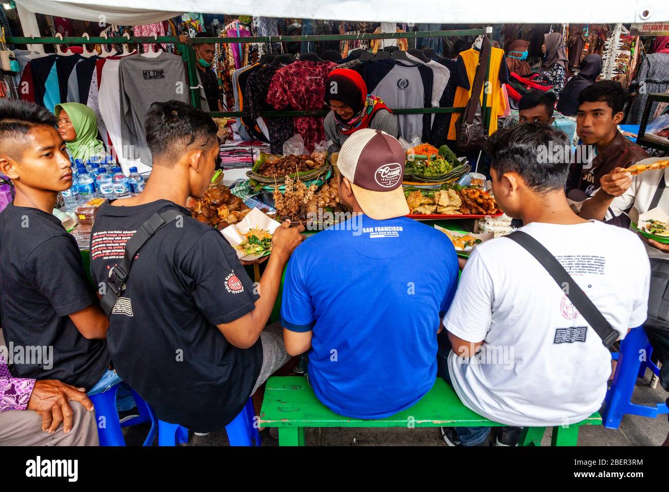 Young Indonesian Men Eating Food At A Street Food Stall, Malioboro