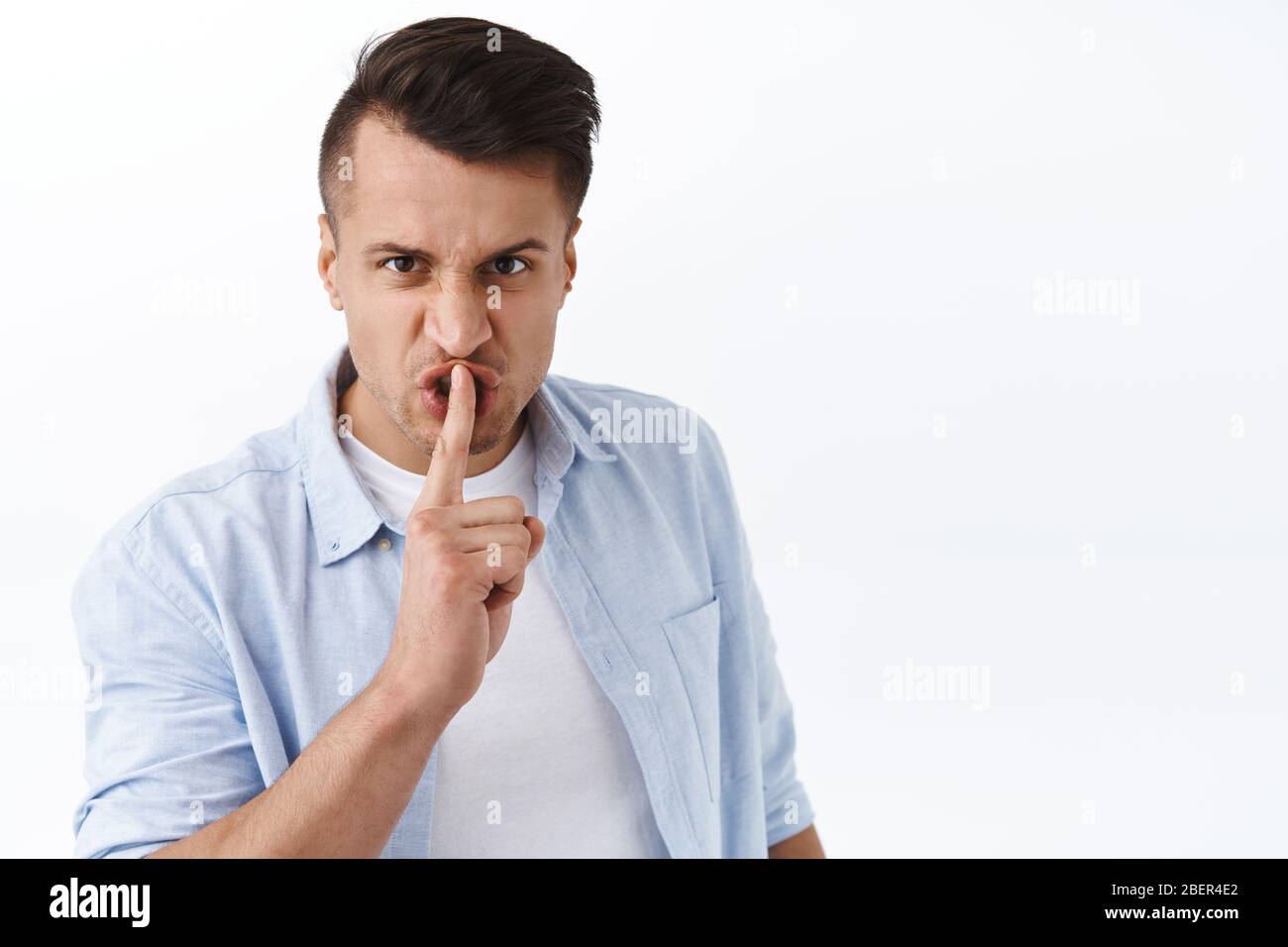 Portrait of angry, sick and tired man threaten person to shut up