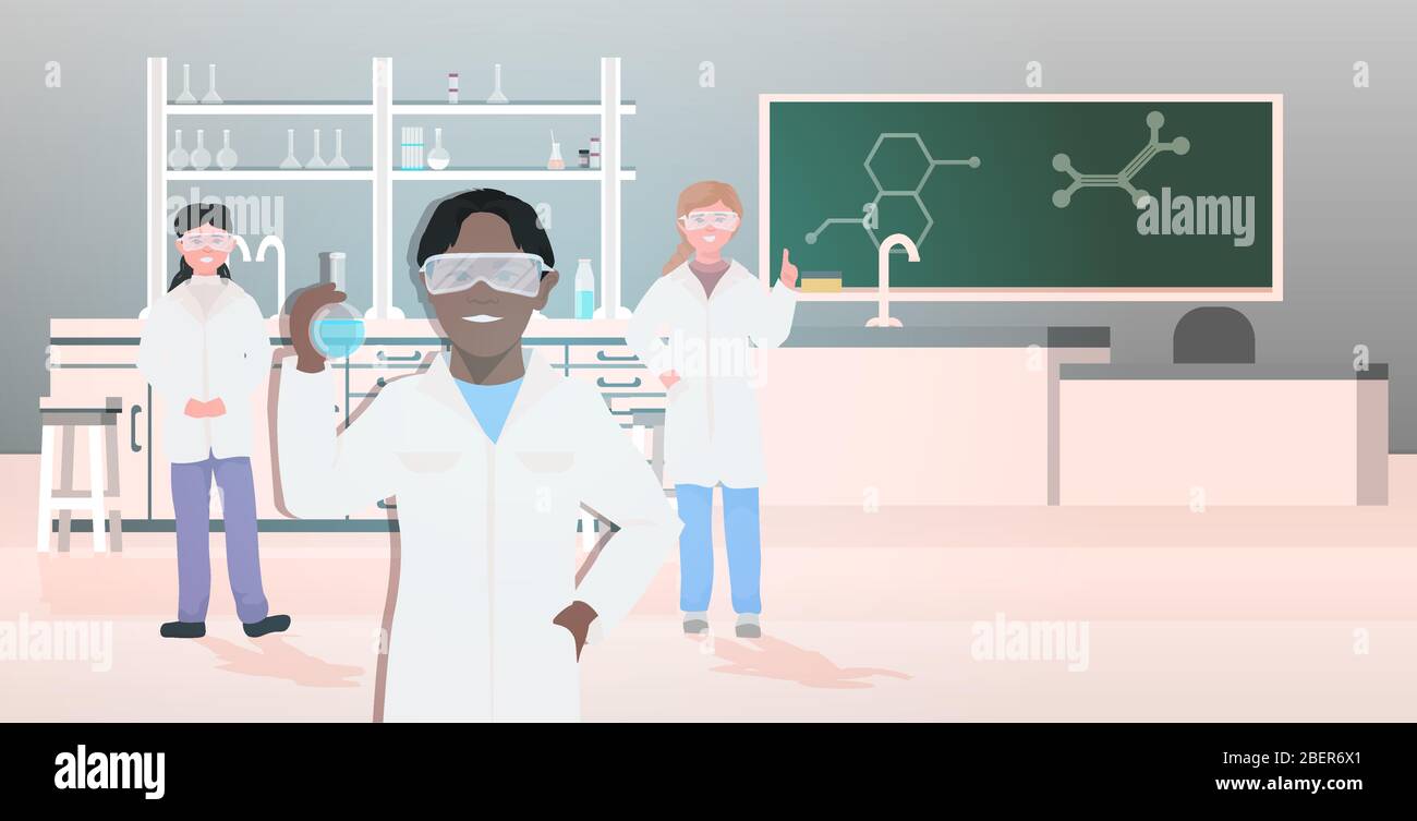 mix race pupils in uniform holding test tubes working in chemical