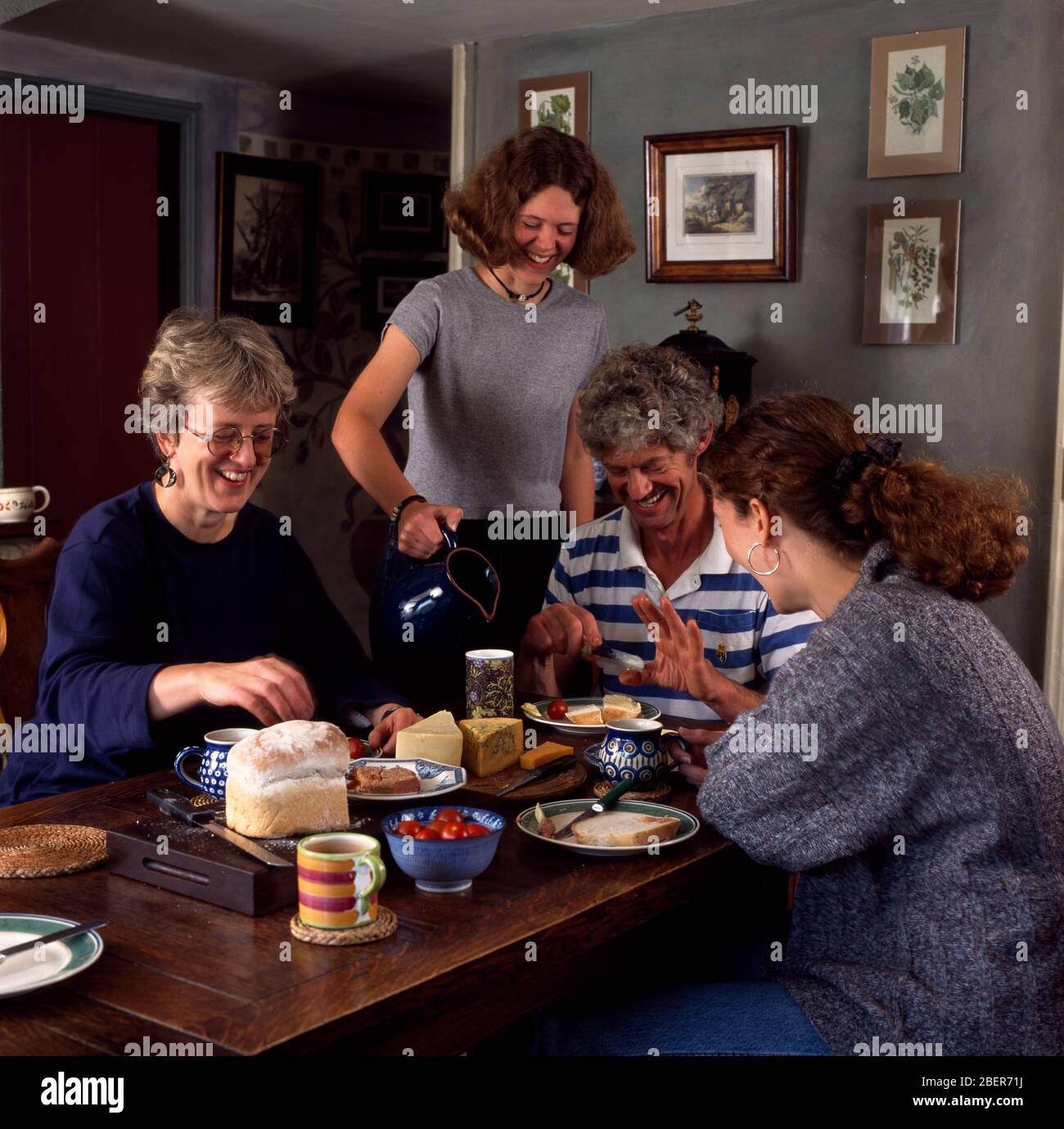 Friends Enjoying Supper Stock Photo Alamy
