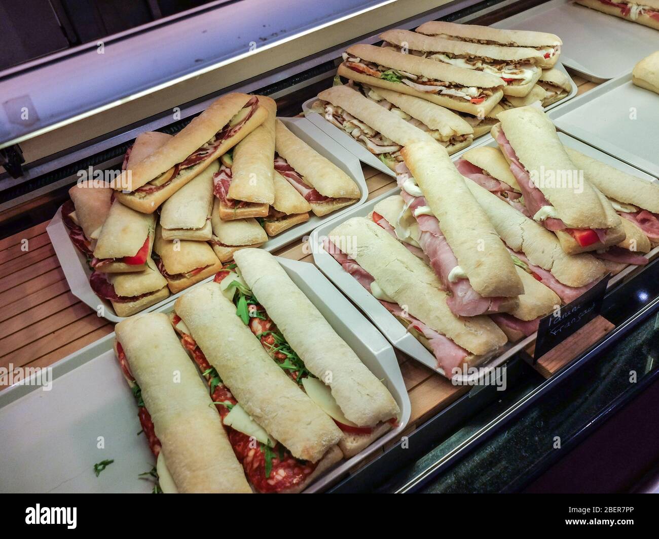Assortment of paninis / sandwiches ready for cooking Stock Photo - Alamy