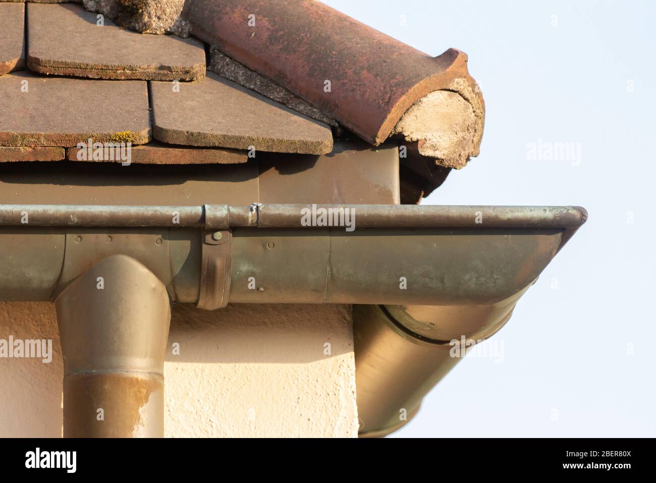 Side view of a rain gutter on the corner of a roof Stock Photo
