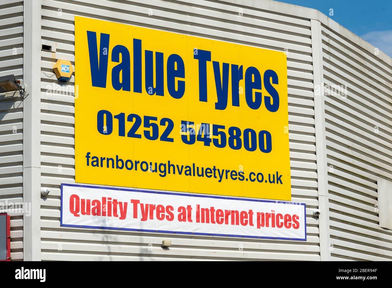 Value Tyres business and signage, a company selling and fitting cheap tyres, UK Stock Photo
