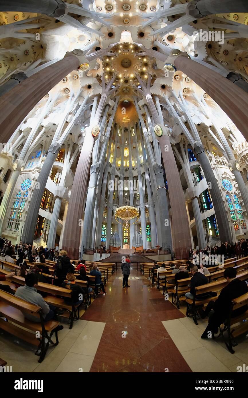 Spain, Catalonia, Barcelona, Interior of the Sagrada Familia designed by Antoni Gaudi, Apse, Altar, Baldachin canopy. Stock Photo