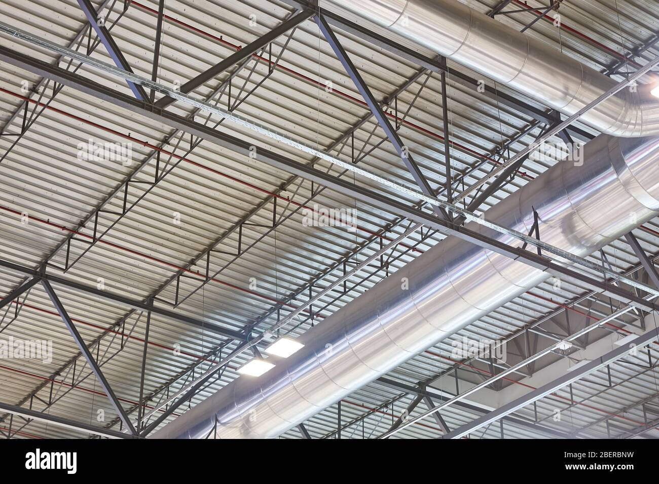 Warehouse building roof stainless air pipes. Climate ventilation structure  equipment Stock Photo - Alamy