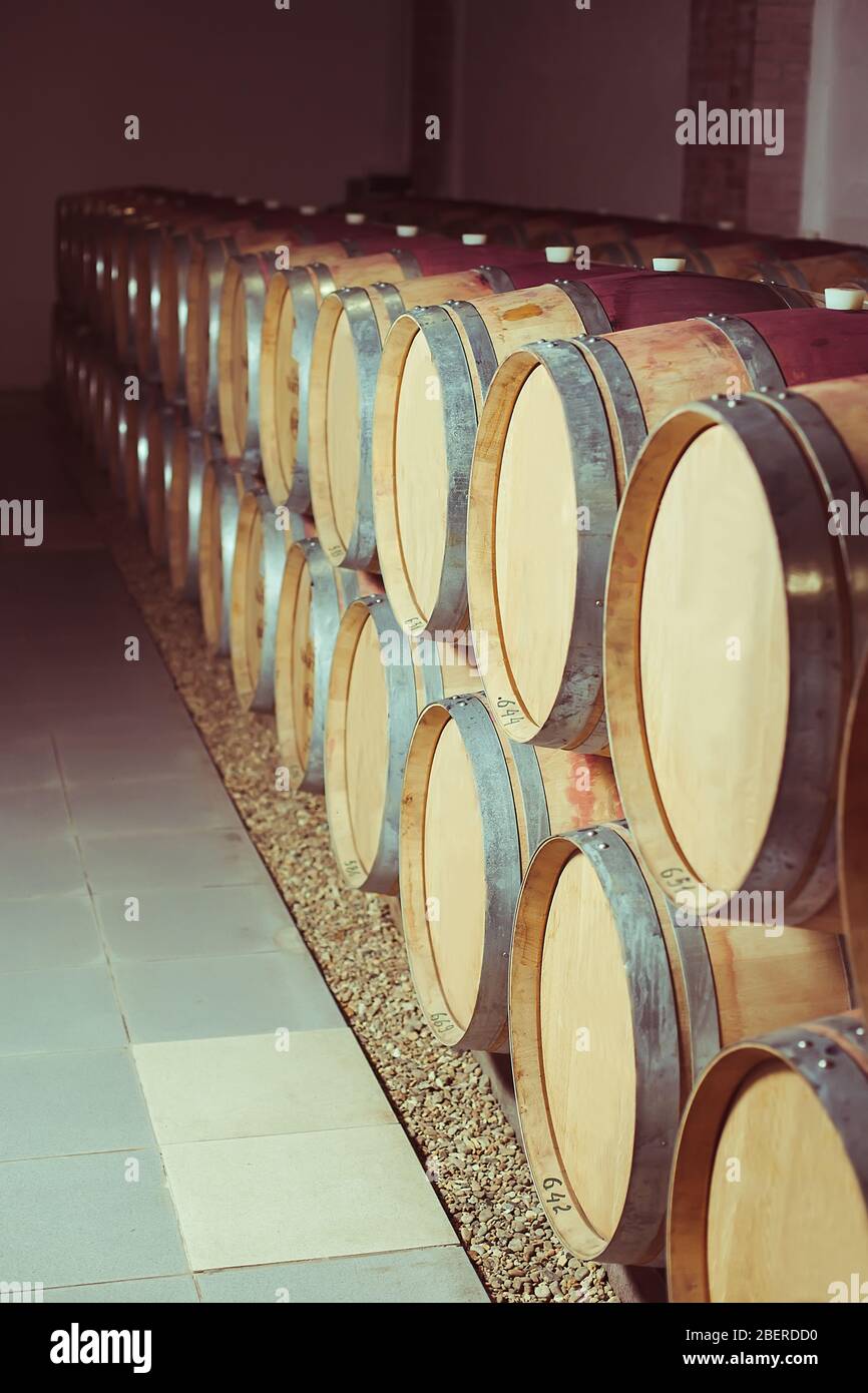 Stacked oak wine barrels in winery cellar Stock Photo - Alamy