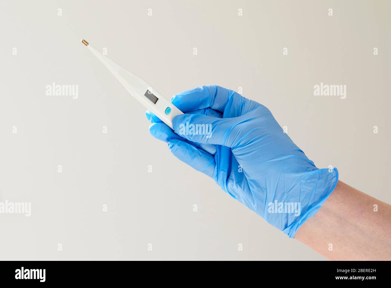 Nurse holding thermometer Stock Photo