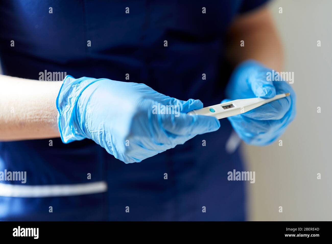 Nurse holding thermometer Stock Photo