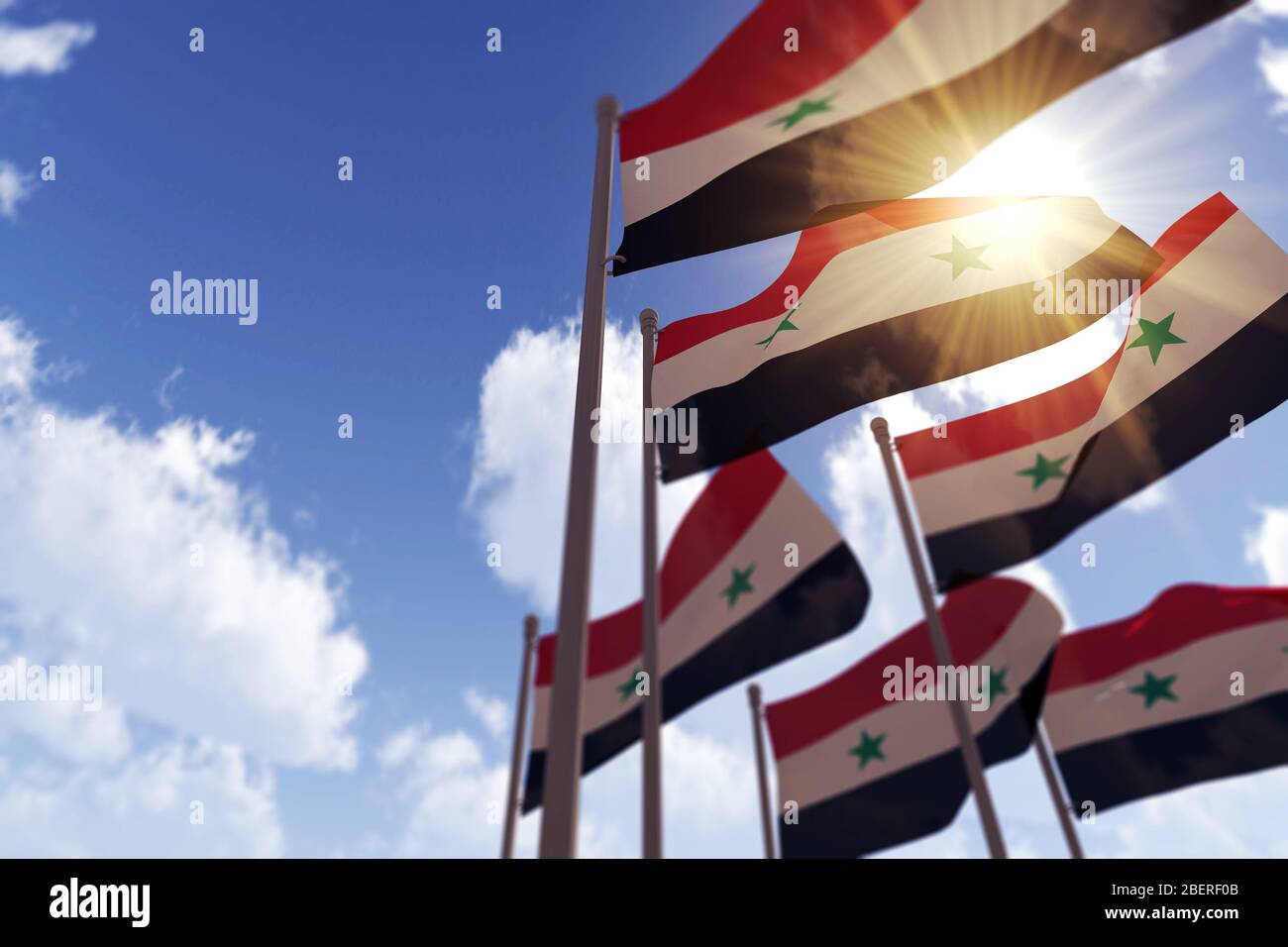 Flag of Syria on a Flagpole Flutters in the Wind Against the Sky