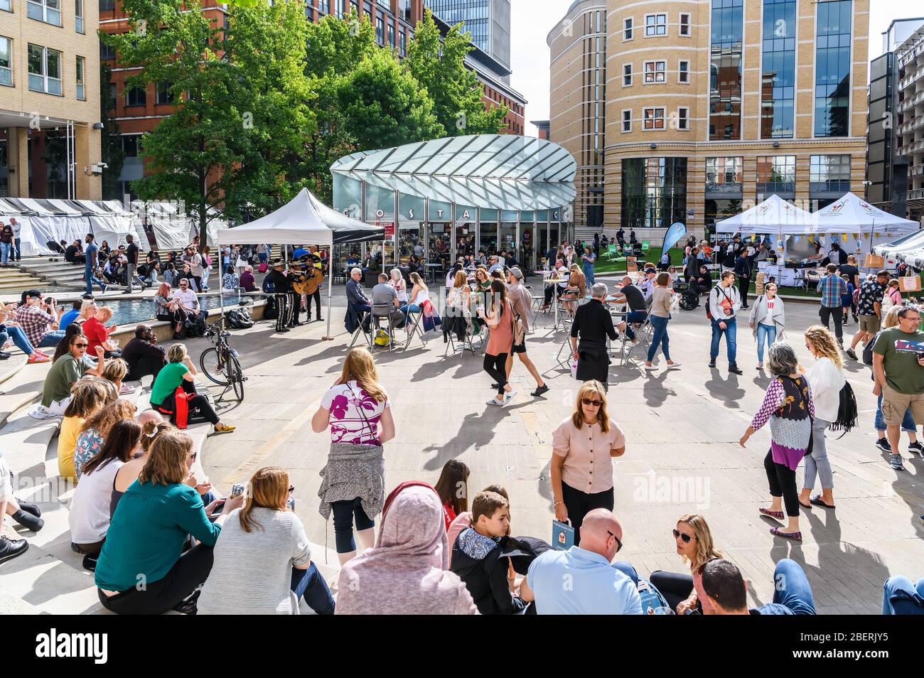A busy and crowded Brindleyplace in Birmingham City Centre during a summer food and drink festival Stock Photo