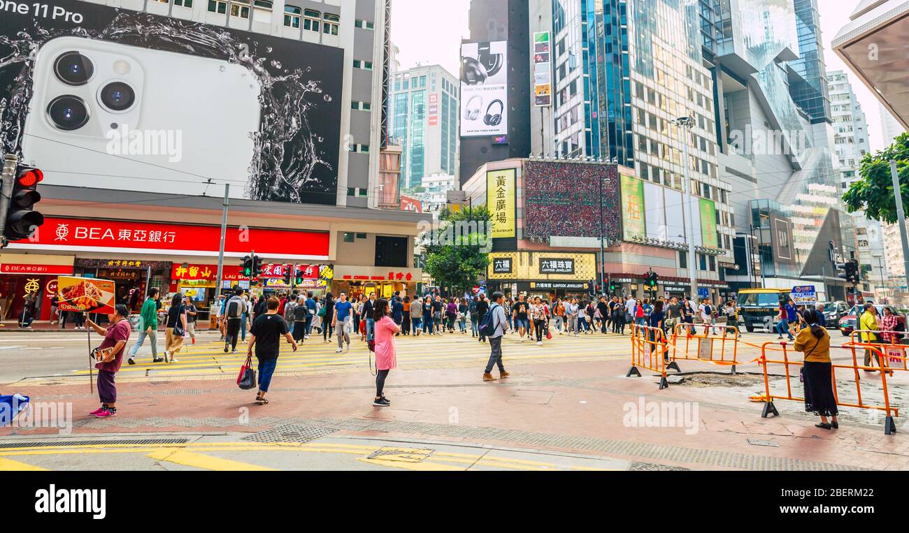 Crowded busy intersection in shopping district of Causeway Bay in Hong Kong Stock Photo