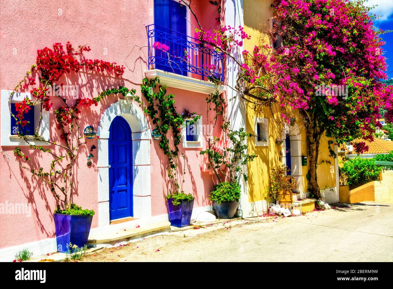 Traditional colorful houses and flowers in Assos village,Cefalonia island,Greece. Stock Photo