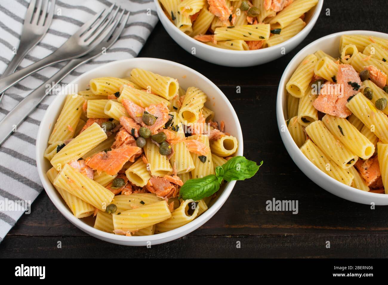 Lemon Garlic Pasta with Salmon: Rigatoni with chunks of salmon tossed with olive  oil, basil, and lemon Stock Photo - Alamy