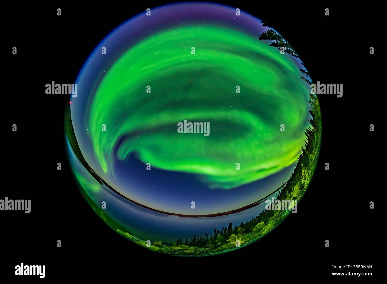 A 360 degree fish-eye view of the northern lights over Prelude Lake, Canada. Stock Photo