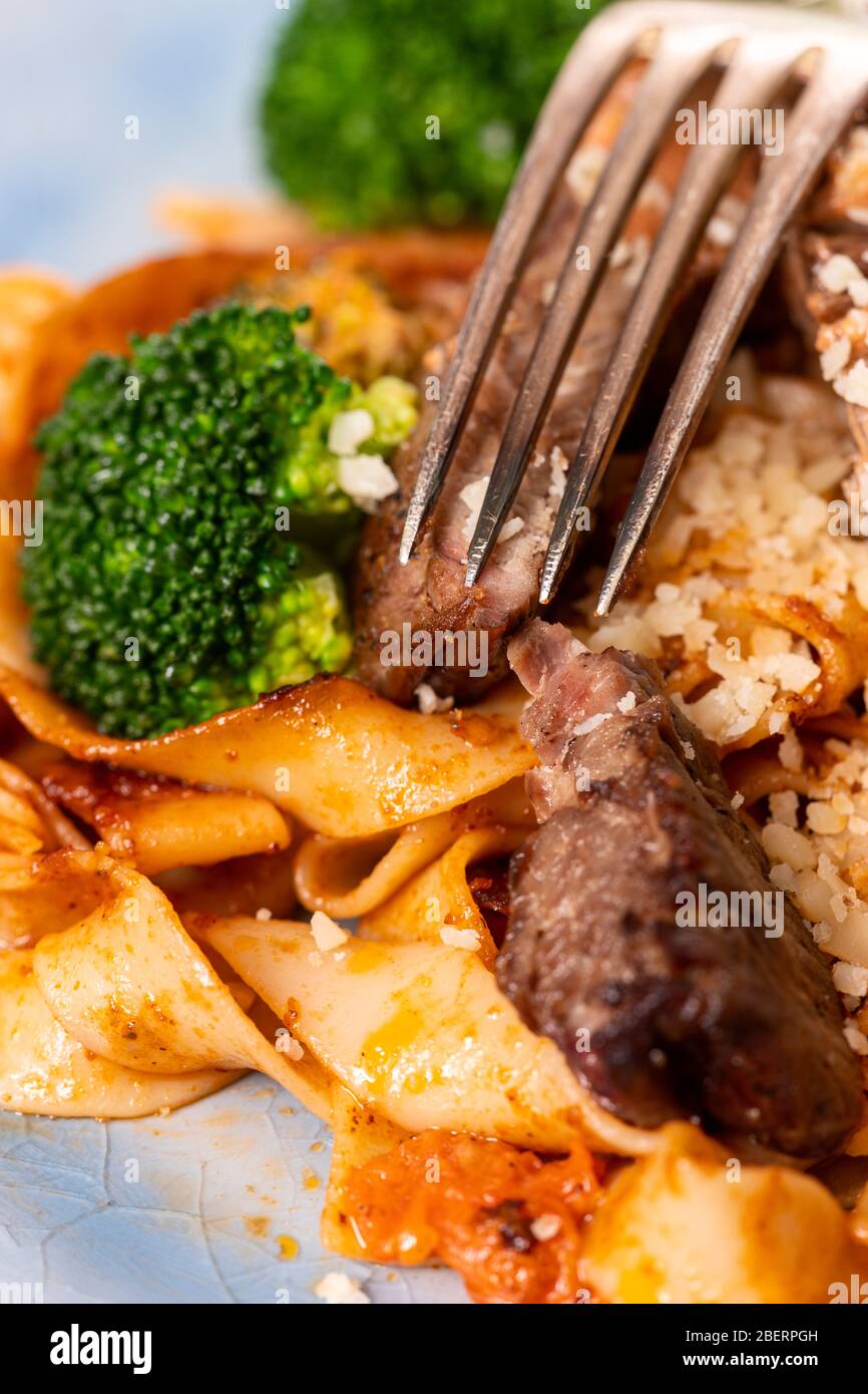 tagliatelli with steak slices on a plate Stock Photo