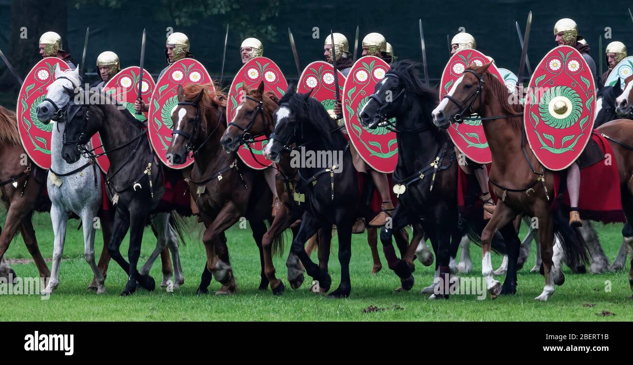 Roman cavalry troops during Turma: Hadrian's Cavalry Charge - a historical reenactment at Bitts Park in Carlisle, Cumbria in 2017 Stock Photo