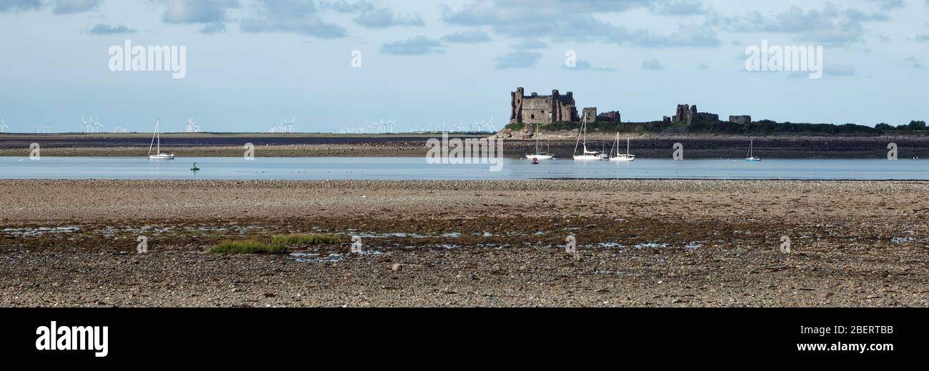 Piel Castle on Piel Island near Barrow in Furness in Cumbria viewed at low tide from Roa Island Stock Photo
