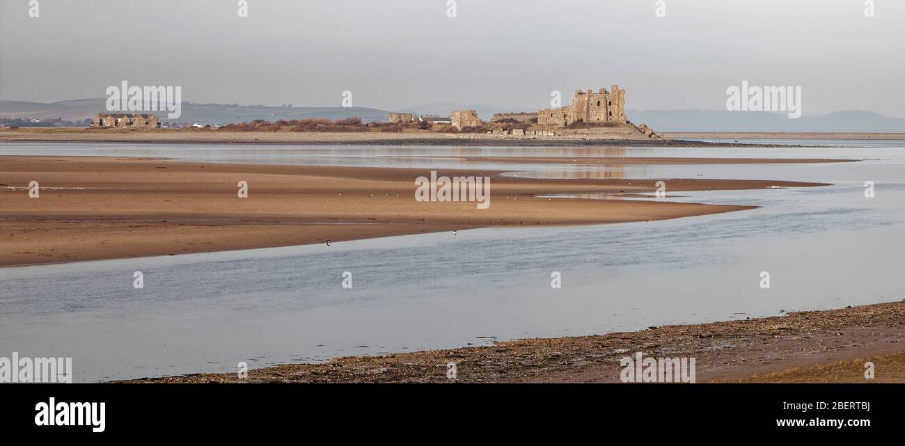 Piel Castle on Piel Island near Barrow-in-Furness in Cumbria viewed at low tide from South Walney island Stock Photo