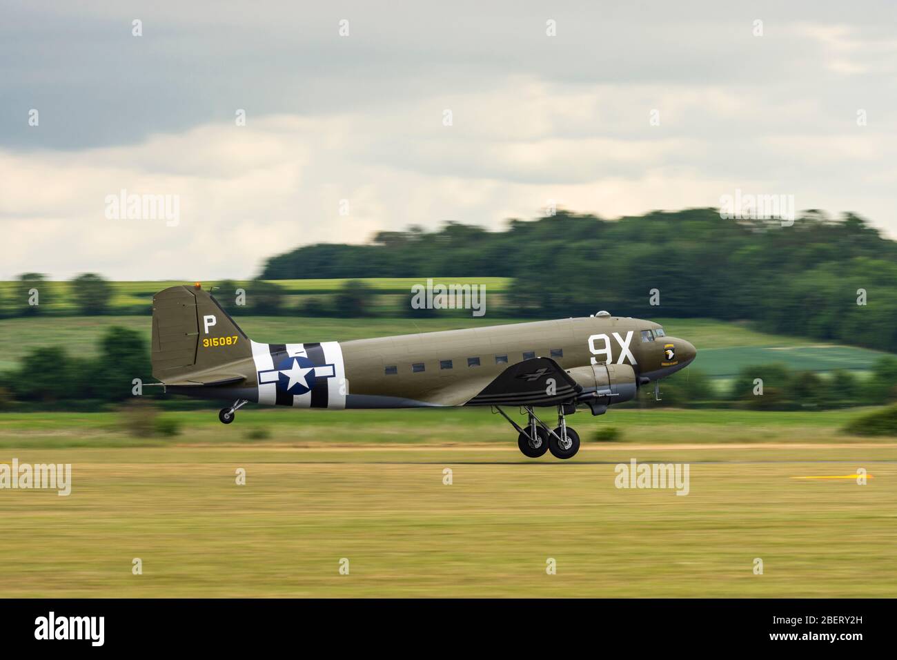 Side view of a USAAF Douglas C 47 Dakota taking off from Duxford during the D Day 75 Commemoration event Daks Over Duxford Stock Photo