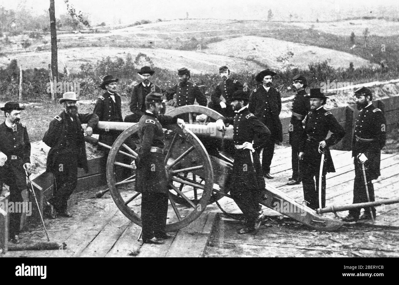 US Civil War -- Major-General William Tecumseh Sherman and his staff on July 19, 1864, at Union Fort #7, during the siege of Atlanta. Sherman is leaning on the cannon's breech. After his capture of Atlanta, Sherman swept through Georgia, destroying everything of value to the Confederacy, thereby seriously weakening the Southern army's supporting supplies system.   To see my Civil War-related images, Search:  Prestor  vintage  Civil War Stock Photo