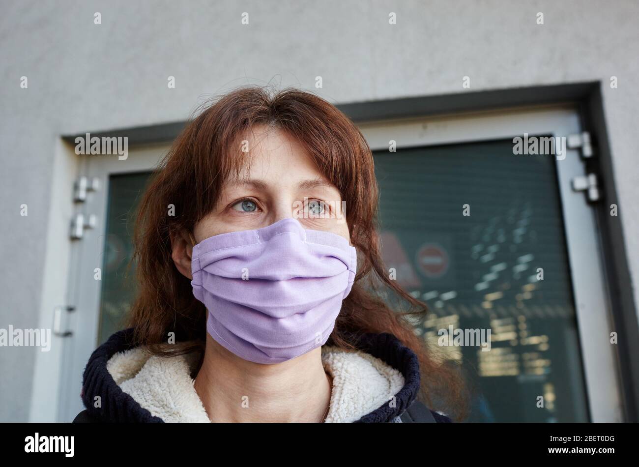 Woman wearing hygienic mask to prevent the Coronavirus. People in masks