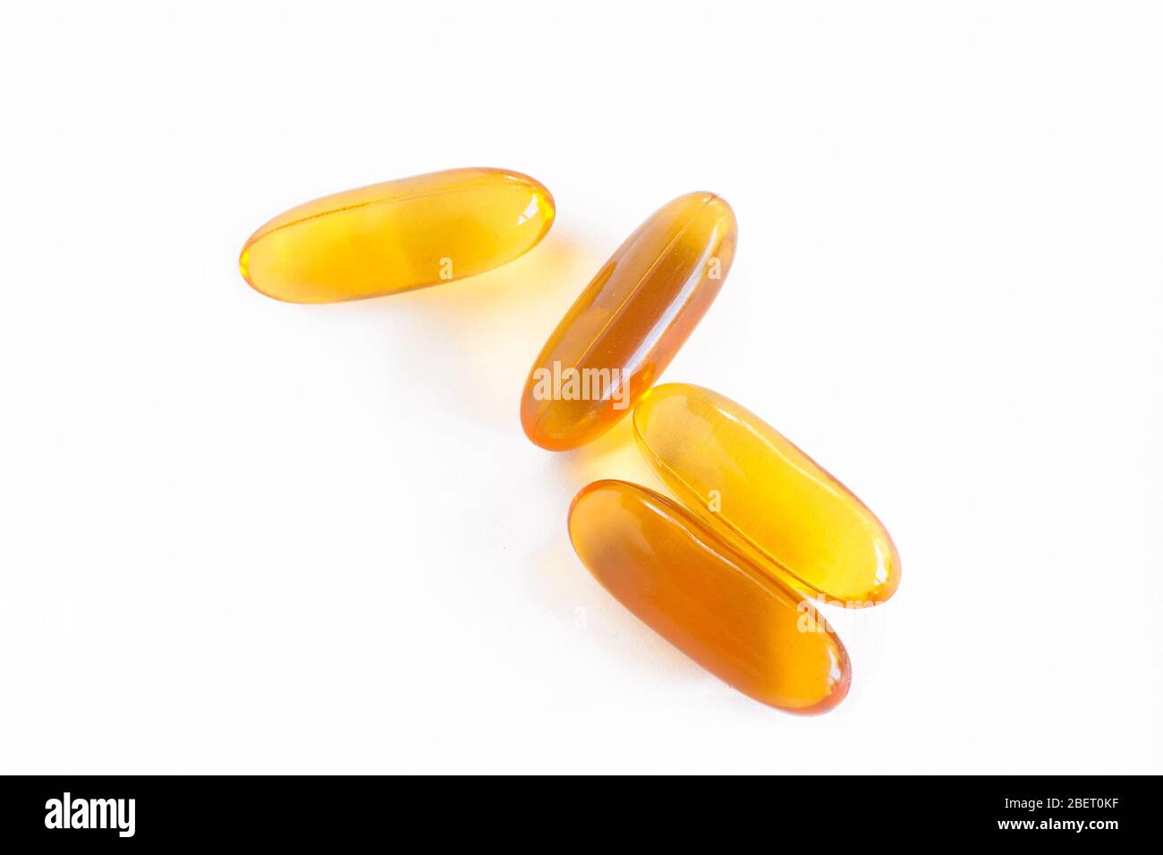 Vitamin Gel Capsules on white background Stock Photo Alamy