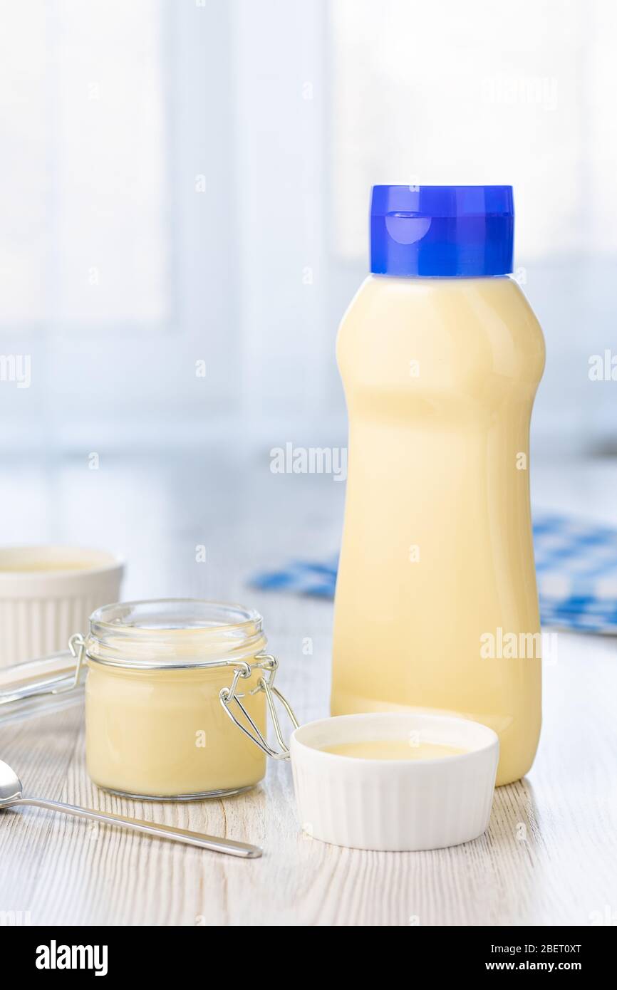 Dairy product. Sweet Condensed or evaporated milk on a table. Stock Photo