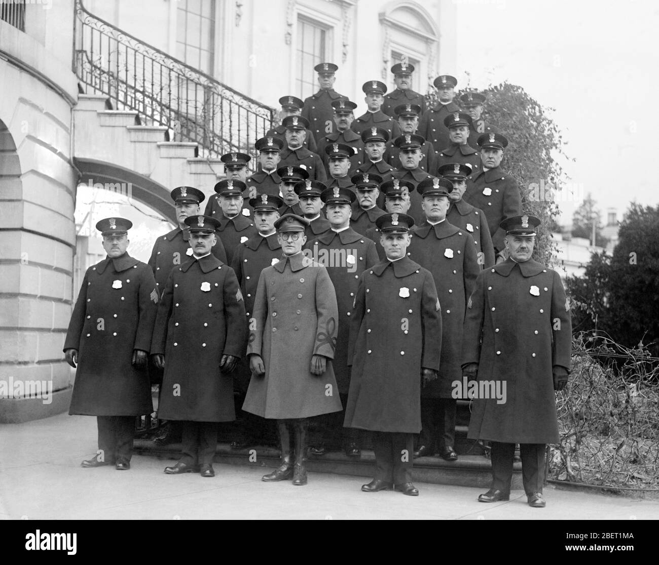 The White House police detail standing in rows on the south portico, 1923. Stock Photo