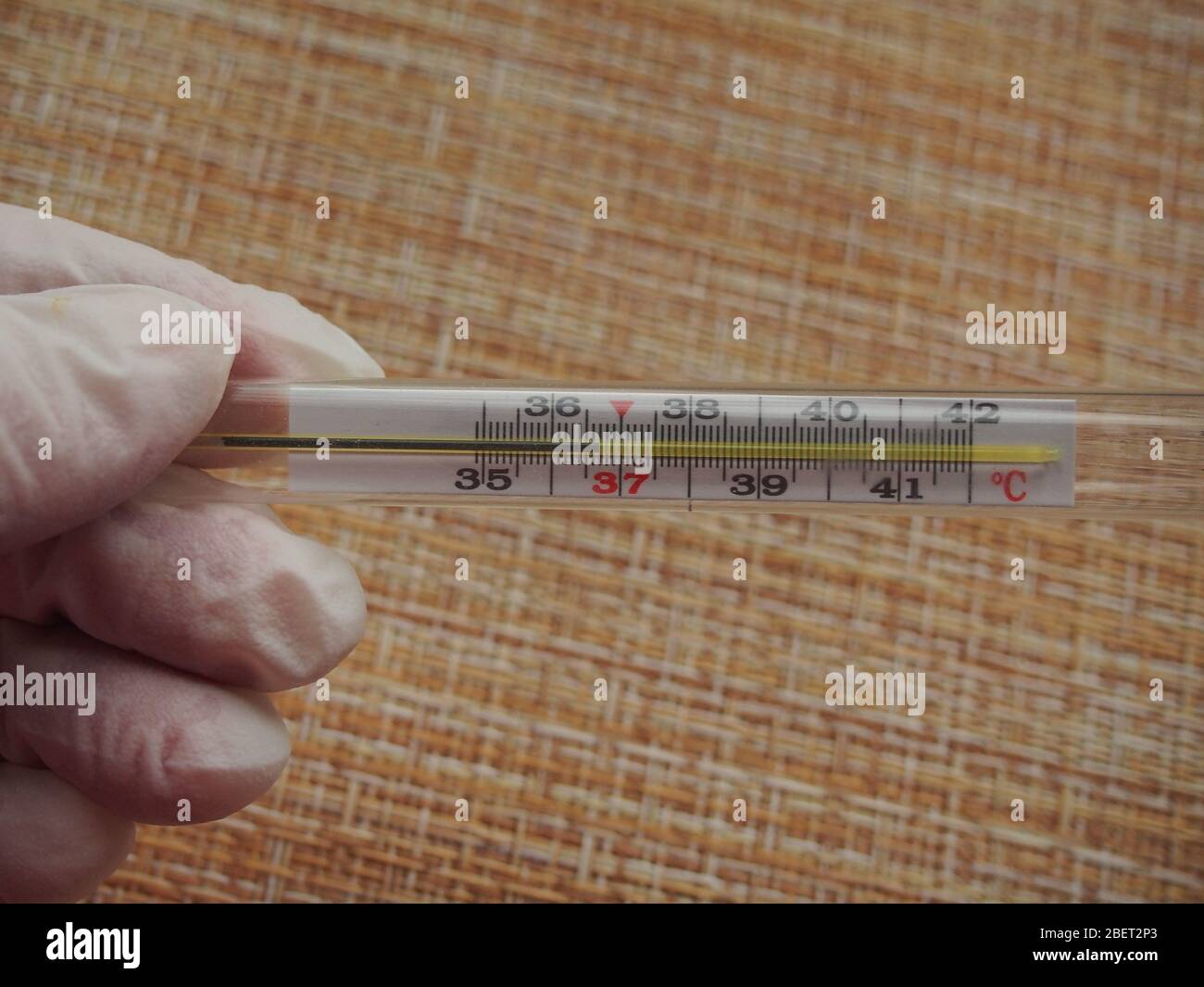 The thermometer shows the normal body temperature. Conducting health