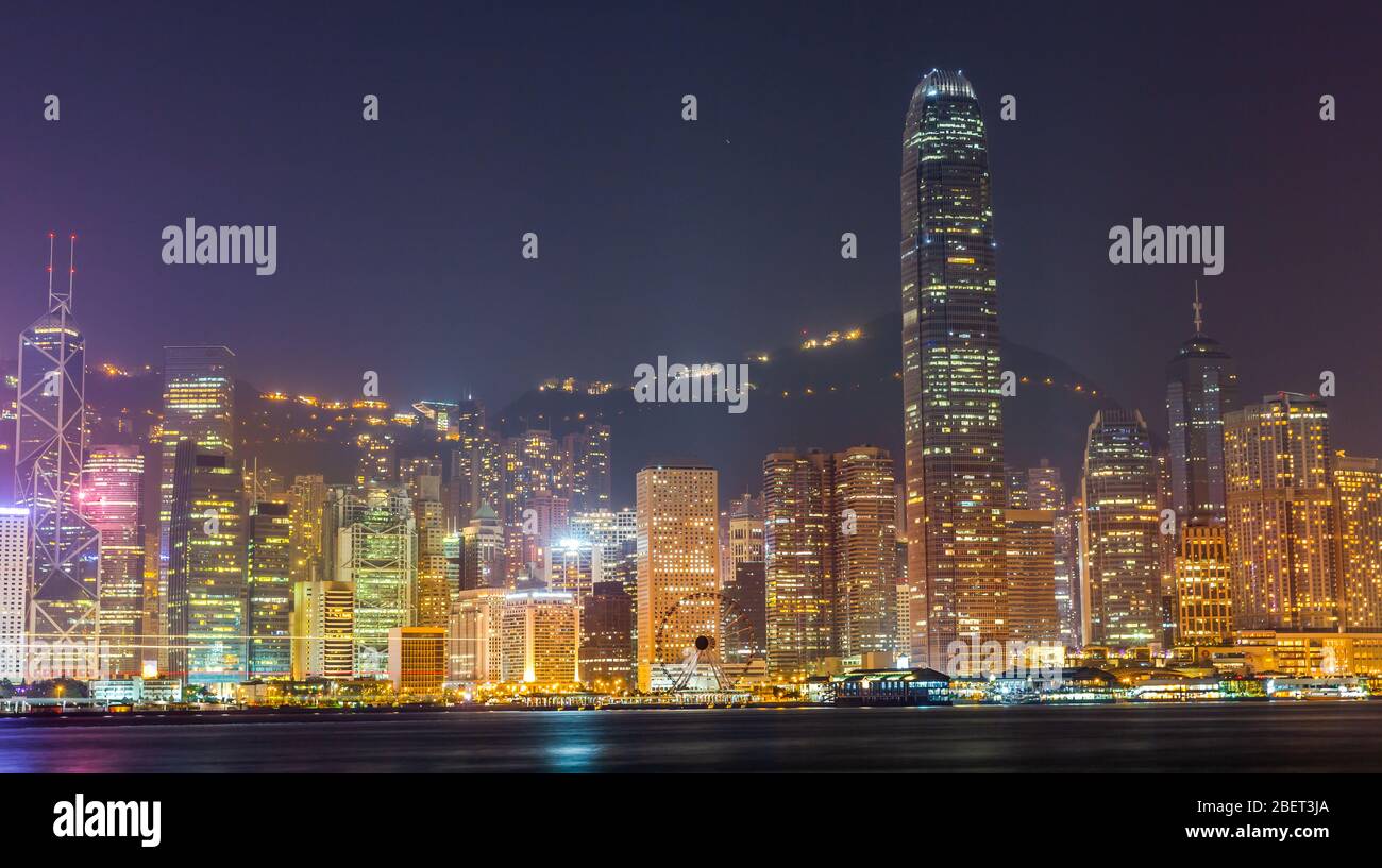 Hong Kong cityscape at night, View From Victoria Harbour. Stock Photo