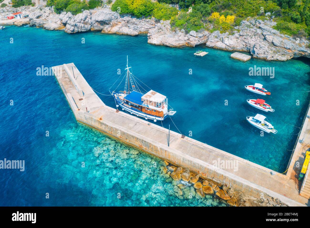 Aerial view of boats and yachts in clear blue water at sunset Stock ...