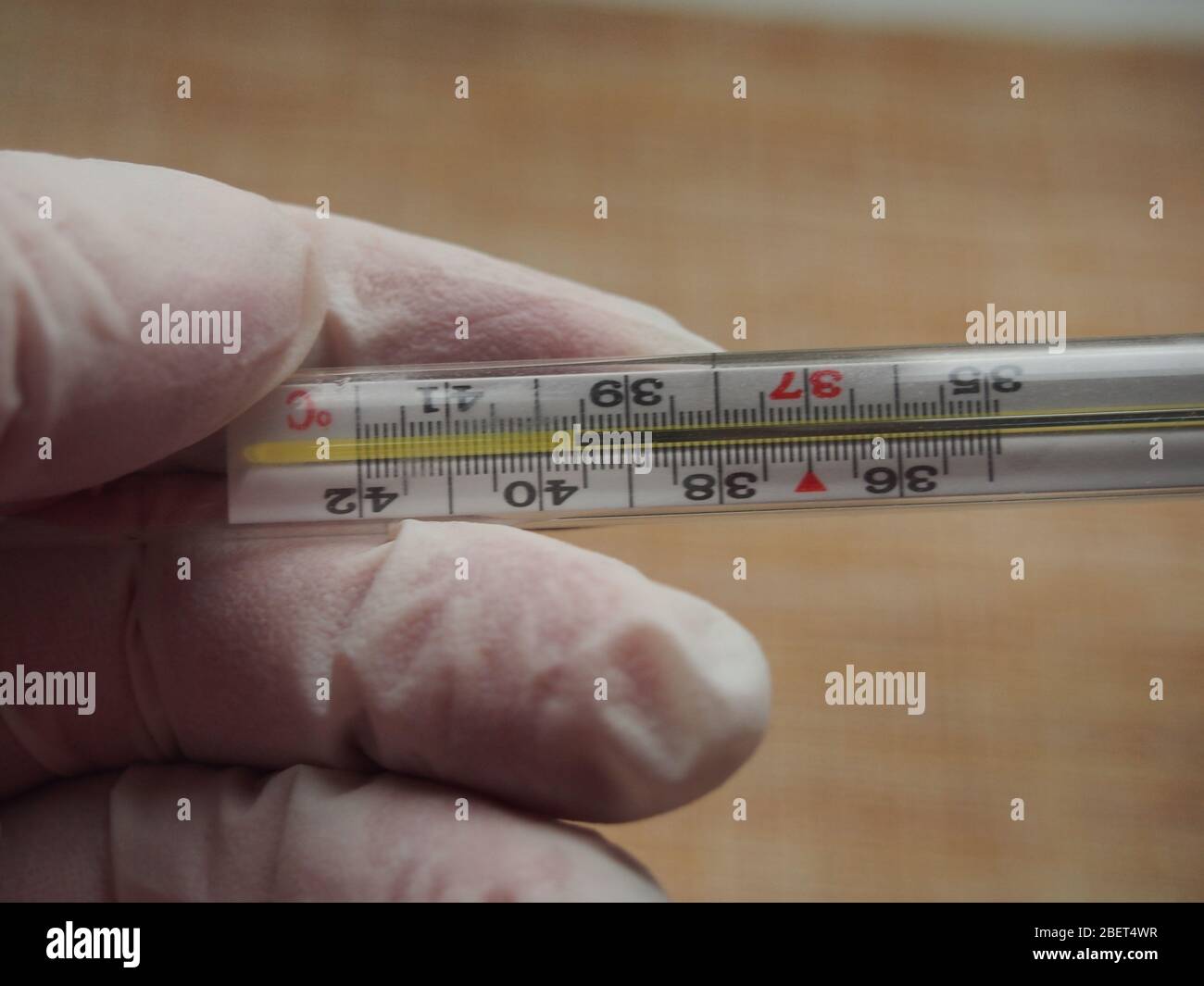 The thermometer shows a high body temperature. Fever. Conducting health