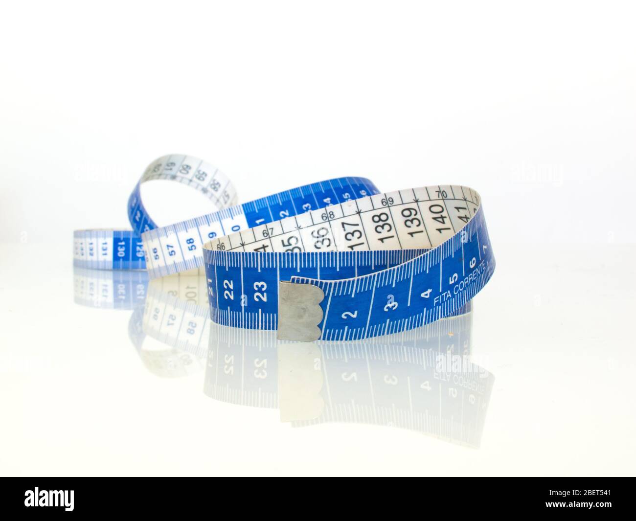 Measuring tape with beautiful reflection Stock Photo - Alamy
