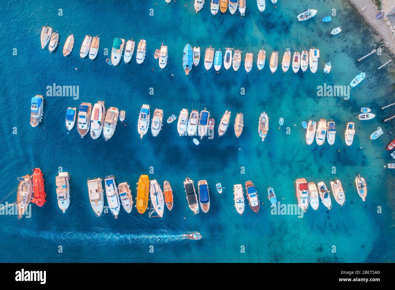 Aerial view of colorful boats and yachts in port in blue sea Stock ...