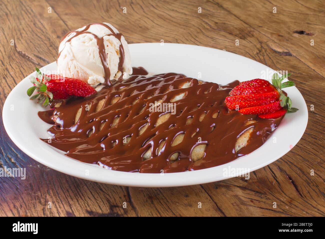 Chocolate Creppe Dessert with syrup, strawberry and vanilla ice cream Stock  Photo - Alamy