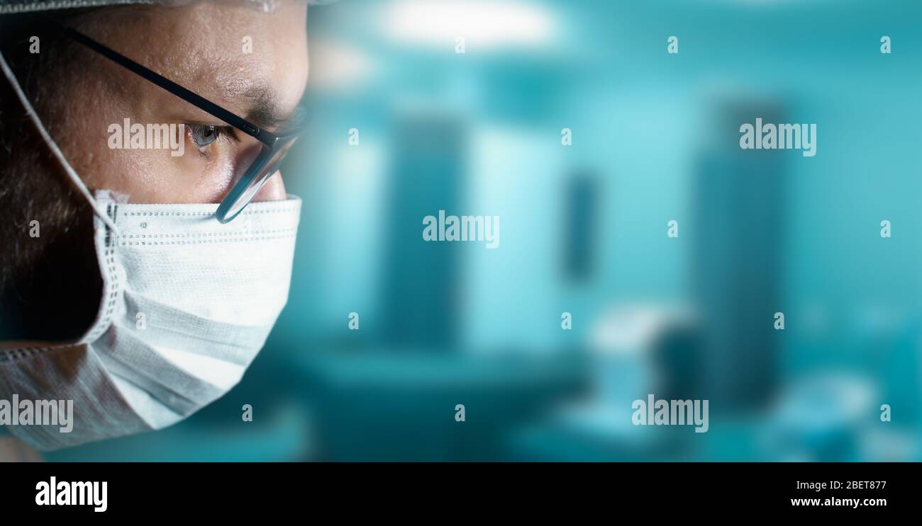 Extreme close-up portrait of a man wearing surgical mask an hair ...