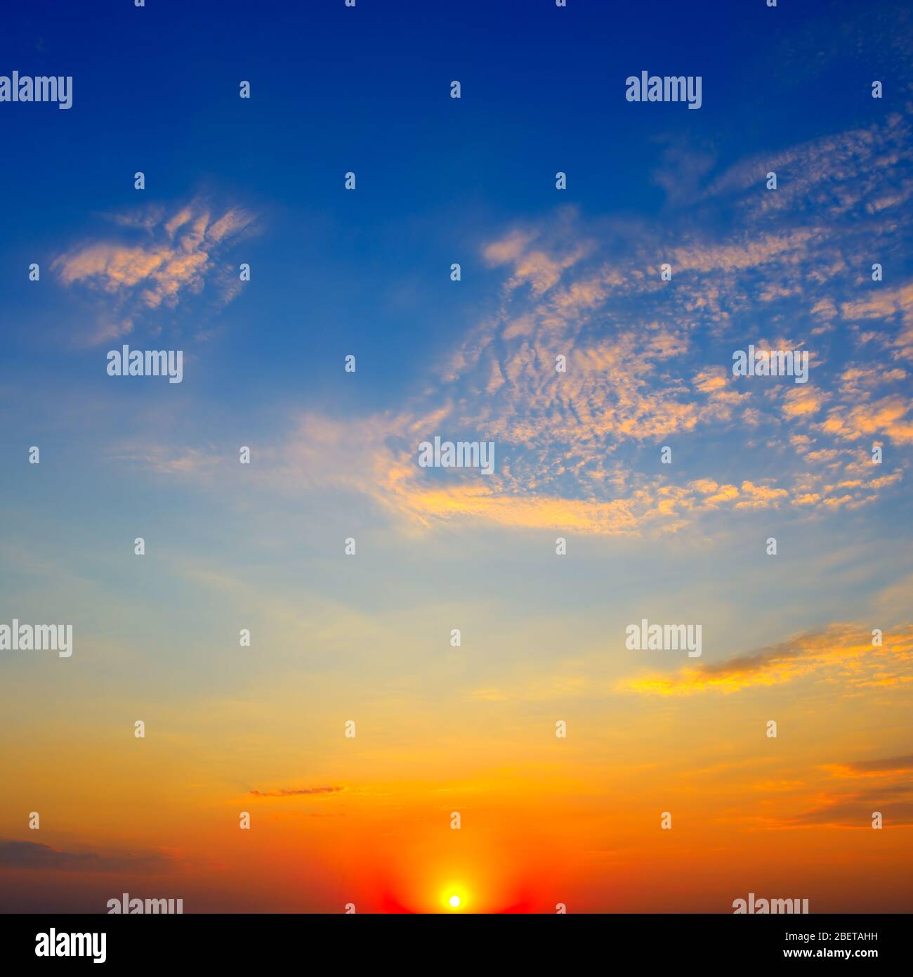Scenic sunset on background bright blue sky and orange clouds Stock ...